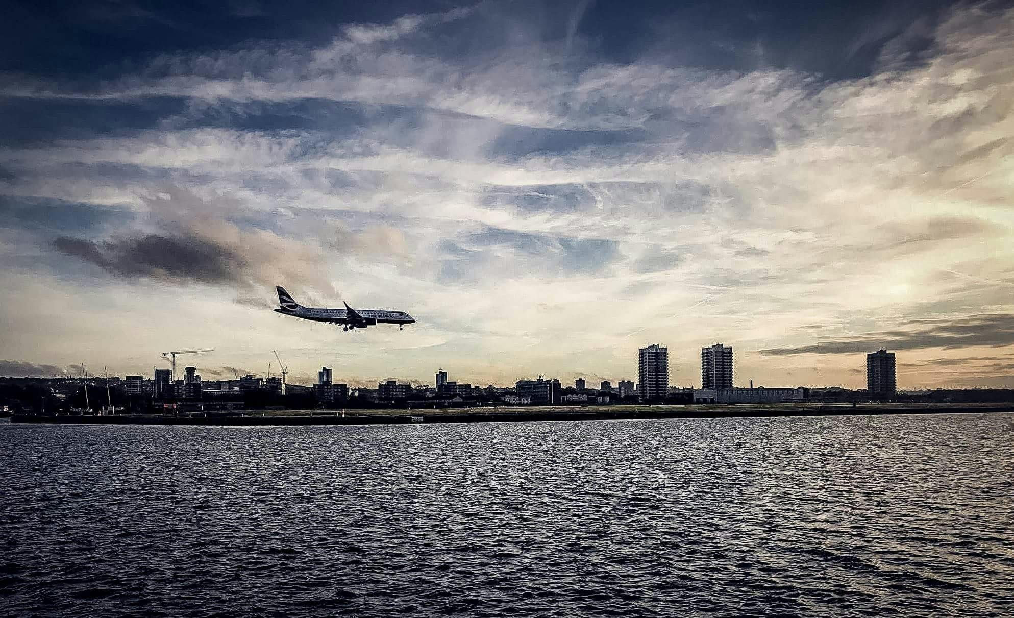 A CL-415 amphibious aircraft skims the water during a demonstration, relevant to the Pentagon's new contracted seaplane initiative for Pacific operations.