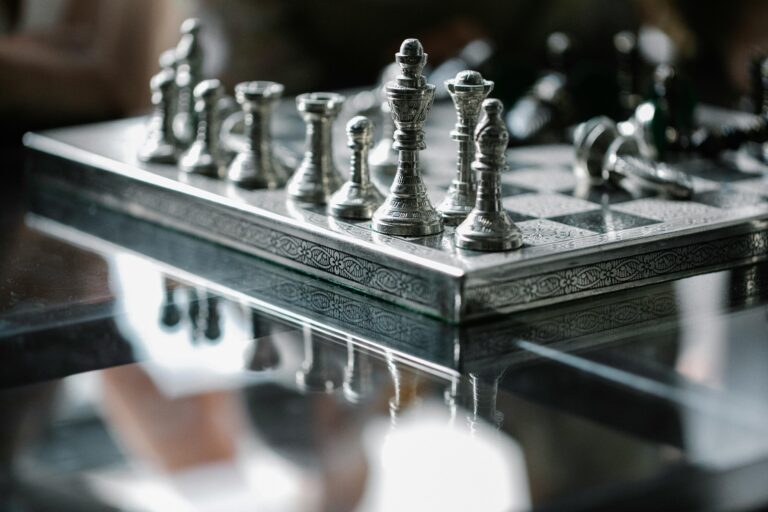 A man wearing a non-invasive BCI headset focuses on a digital Chinese chess board during a competitive match.