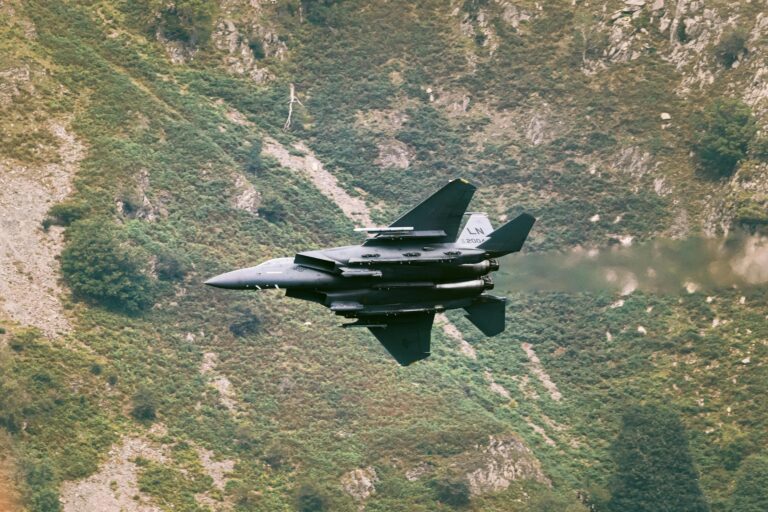 A Chengdu J-20 stealth fighter jet flies in formation during a military demonstration.