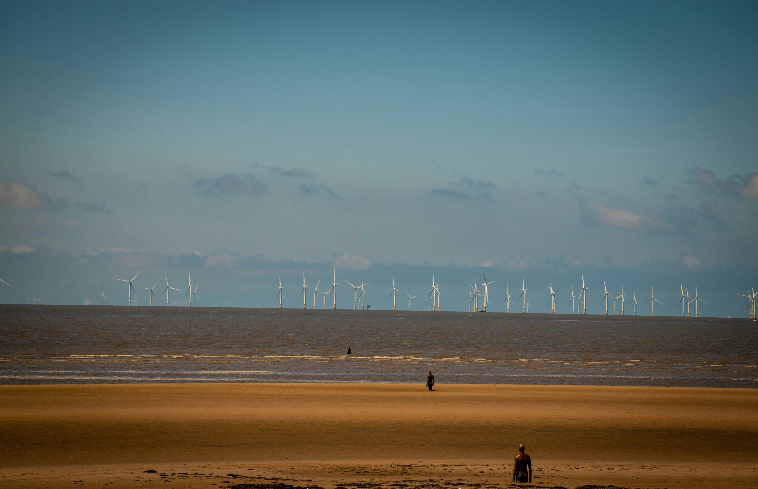Aerial visualization of Inyanga Marine Energy Group's HydroWing tidal energy project at Morlais, Wales, featuring multiple underwater turbines generating renewable electricity from tidal currents.