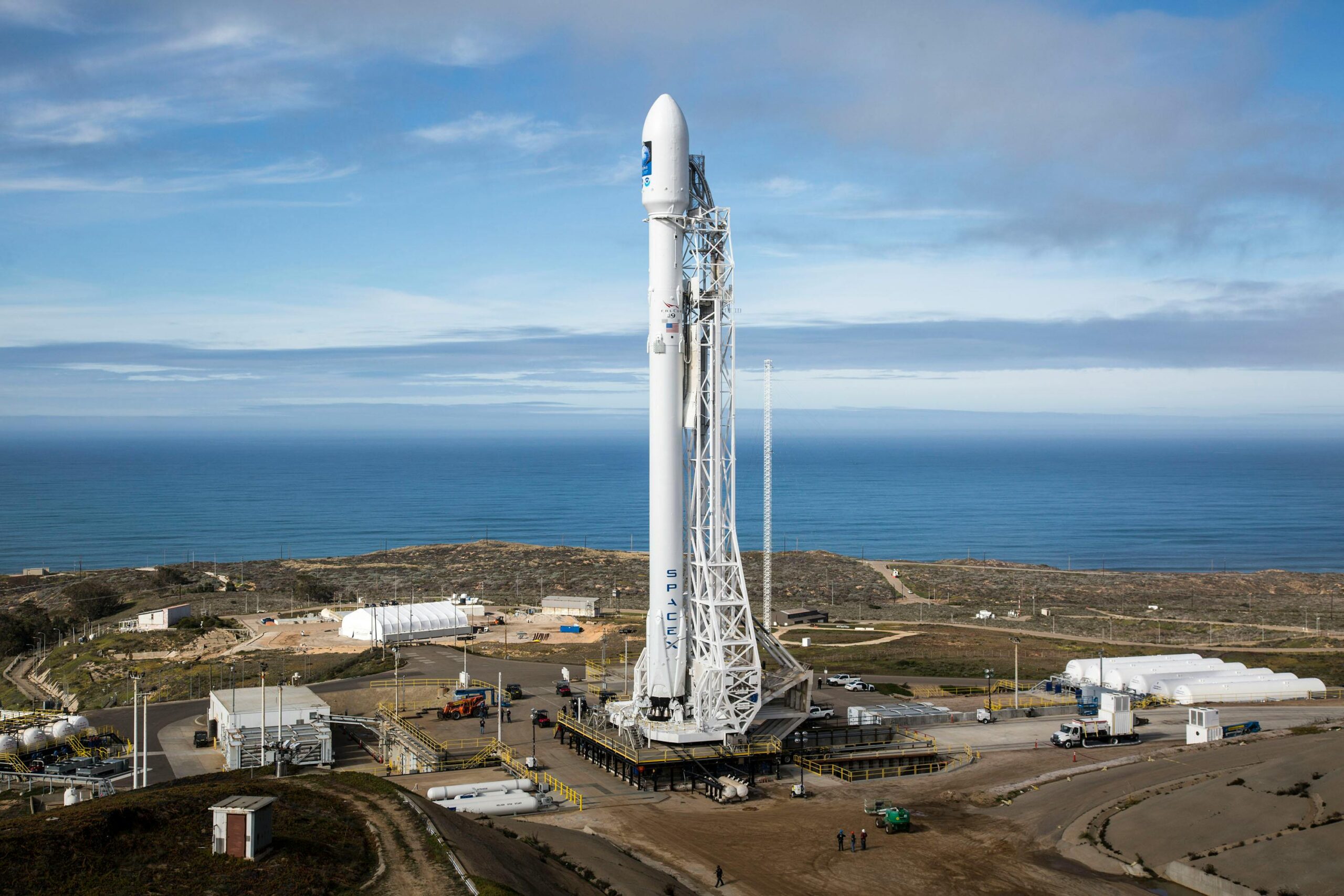 Hypersonix DART AE vehicle mounted on Rocket Lab HASTE launch rocket at Wallops Island launch complex with launch tower in background