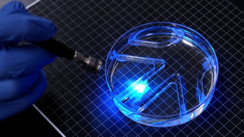 MIT engineers built a paper-thin swimming robot powered by one layer of living muscle cells that move when light hits them.